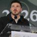 Samuel García | La Silla Regia Man Speaking at a Podium with Two Microphones During a Formal Event, Blurred Backdrop Showing 2026 Behind Him. | La Silla Regia