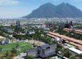 Aerial View of a City with a Large Sports Field, Festival Grounds, and Industrial Structures, Set Against a Mountain Backdrop. | La Silla Regia