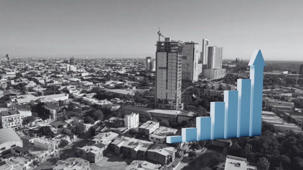 Urban Skyline in Grayscale with a Blue 3d Bar Chart Rising on the Right, Symbolizing Growth or Progress. | La Silla Regia