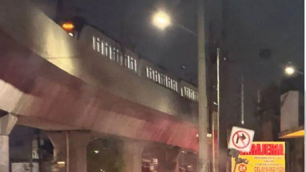 Nuevo-leon-samuel-garcia-metro | La Silla Regia Night Street Scene Under an Elevated Concrete Overpass with a Visible No-left-turn Sign Near Storefronts and a Streetlamp. | La Silla Regia